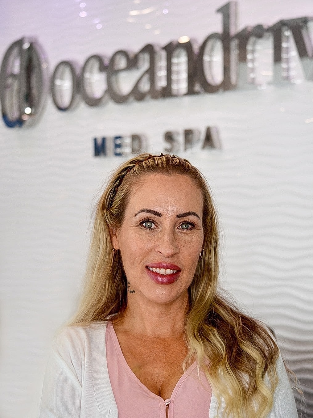 Woman smiling at Ocean Drive Med Spa.
