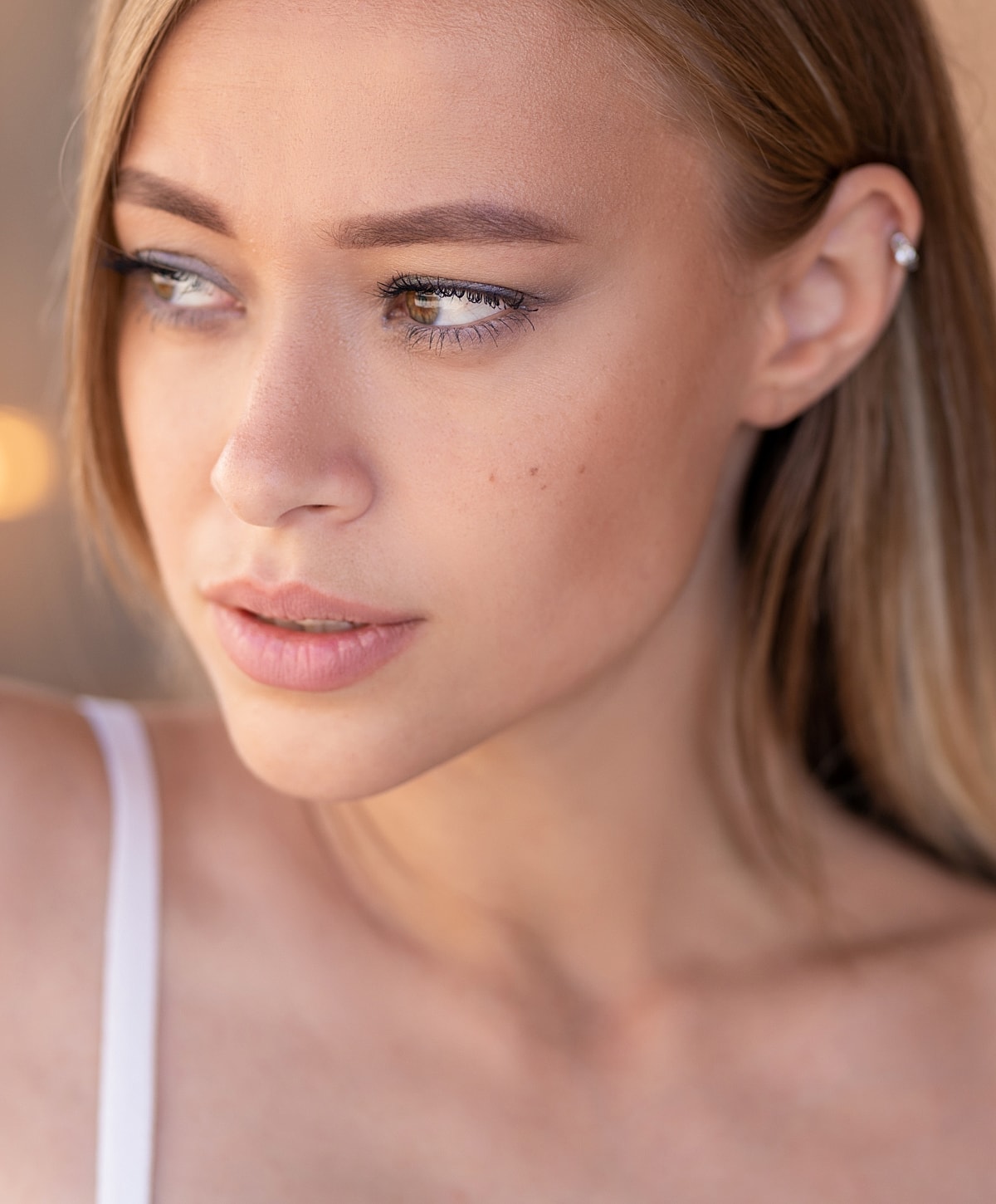 Close-up of a woman's thoughtful expression.