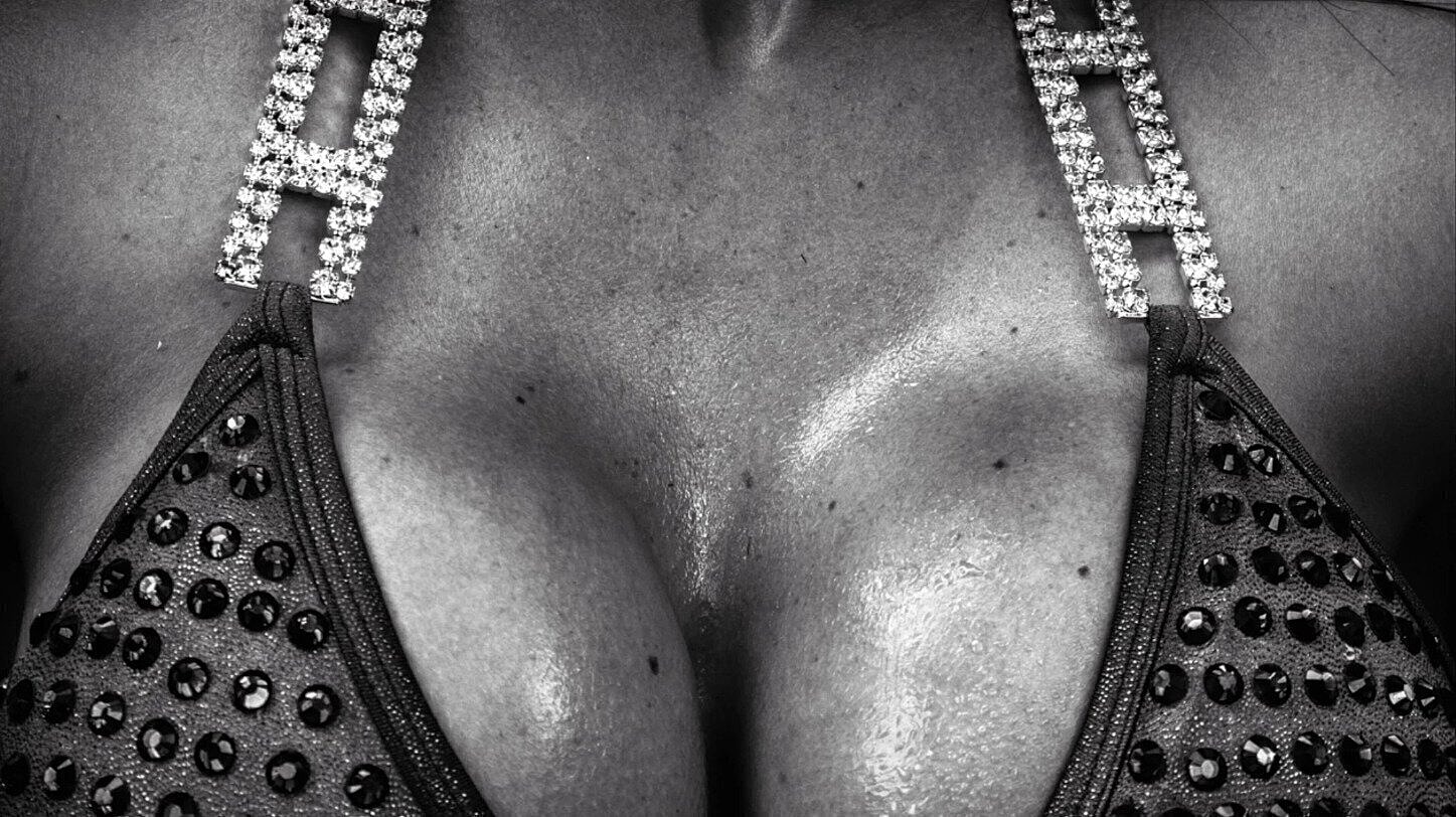 Close-up of embellished swimwear in black and white.