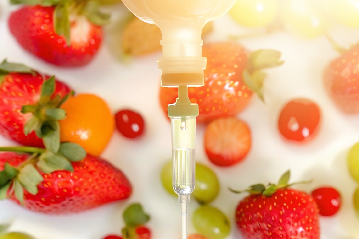 IV drip above vibrant assortment of fruits.