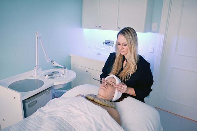 Woman giving massage to patient