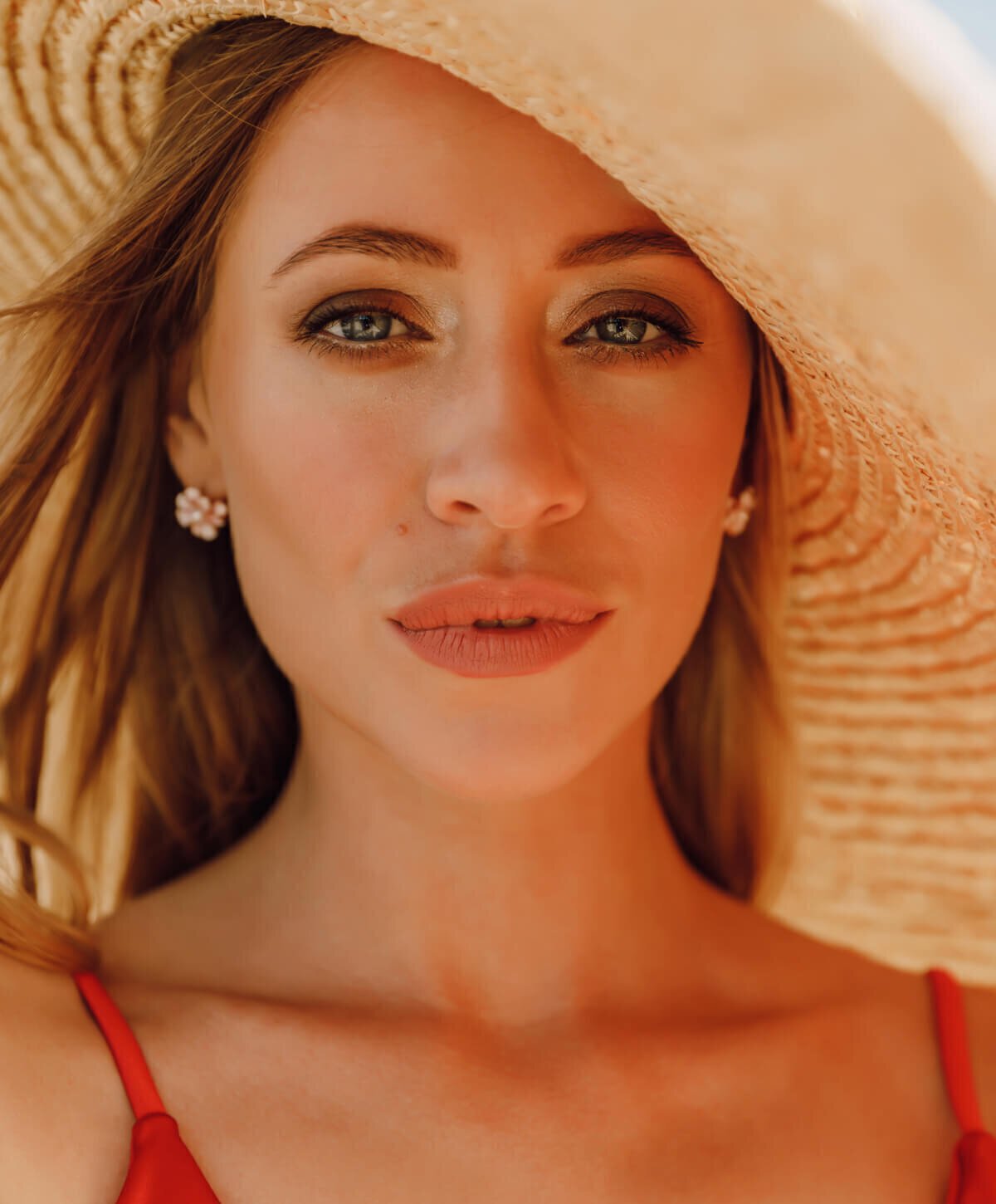 Vero Beach Restylane model wearing a hat