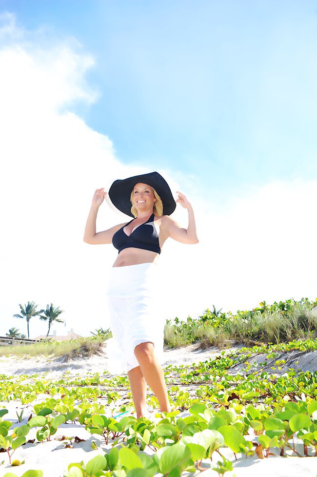 Vero Beach Breast Lift patient wearing a hat
