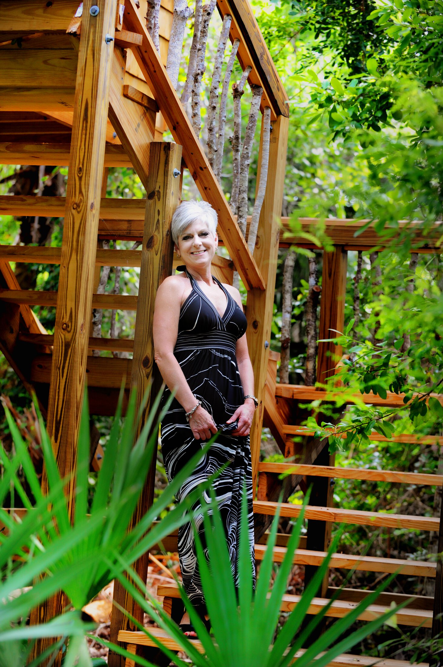 Ocean Drive Plastic Surgery breast revision patient model in a dress