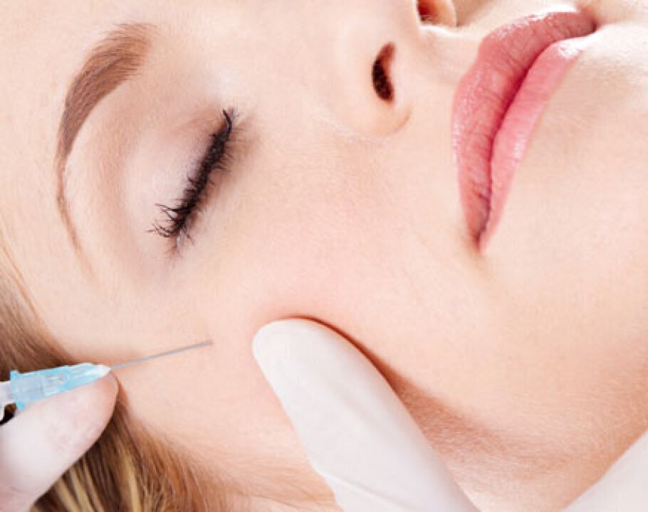 Dermal fillers patient with smooth skin receiving injection