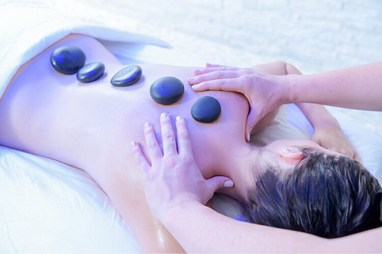 Massage feature - Woman getting hot stone massage
